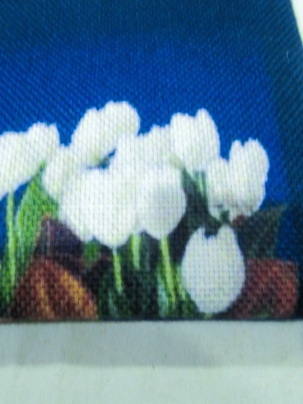 Society 6 blue cosmetic bag, white lilies, 6-1/2